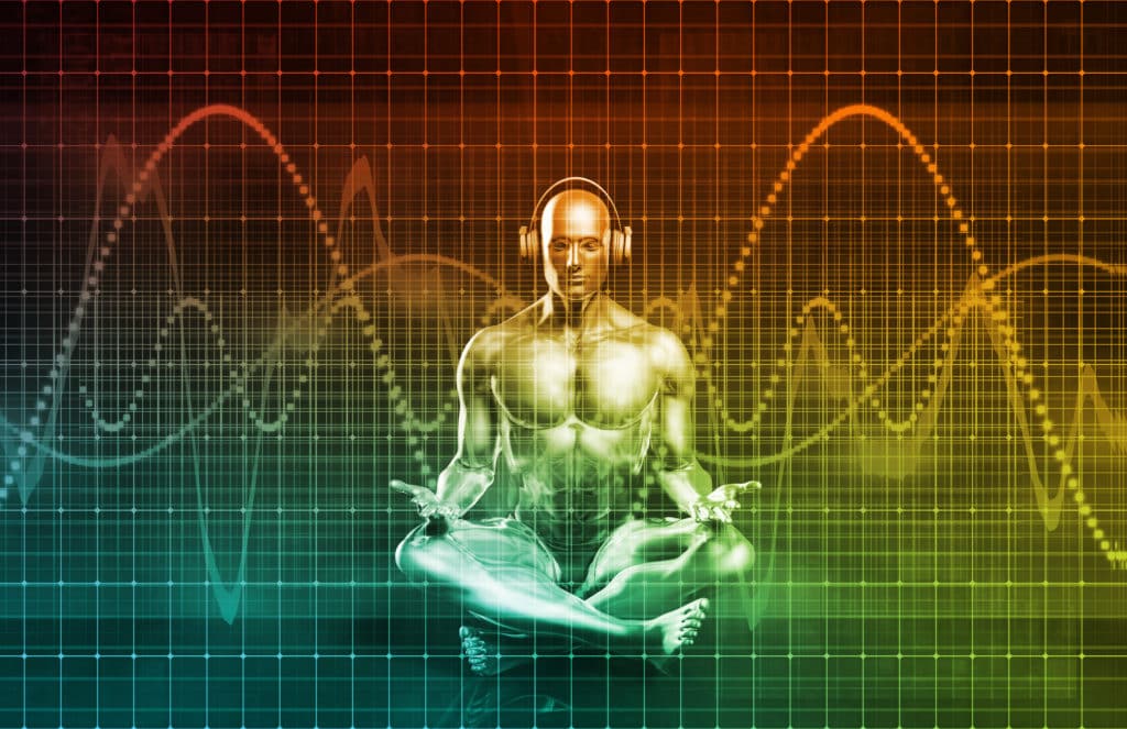 Illustration of a figure seated in meditation wearing headphones, against a backdrop of colored sound waves